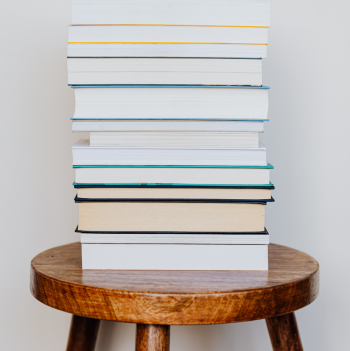 Stack of books on a wooden stool